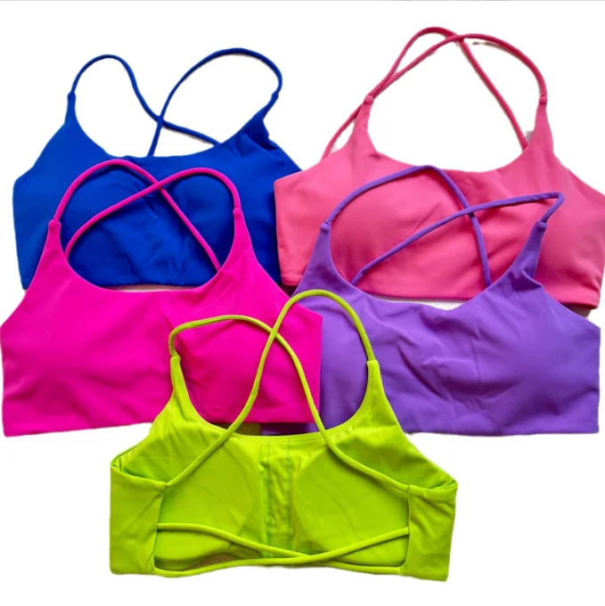 Women's Yoga Tops for Easy Flexibility -A nude fitness bra with thin straps and a cut-out back
